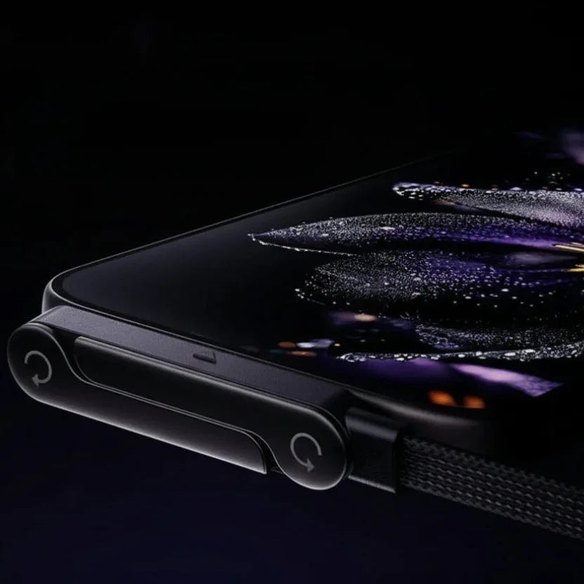 Close-up of a foldable smartphone with a vivid flower wallpaper on its screen
